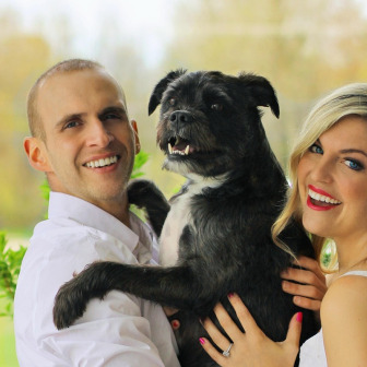family couple smiling outdoors